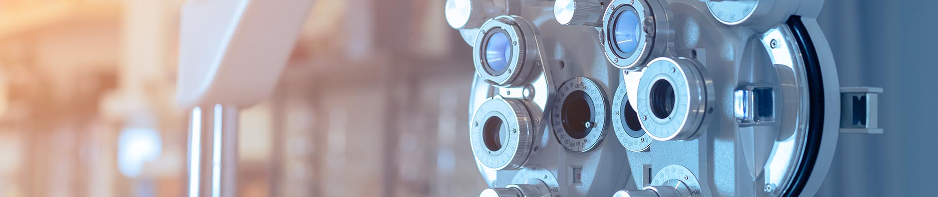 The image shows a modern dental clinic interior with various pieces of equipment, including a dental chair and an X-ray machine.