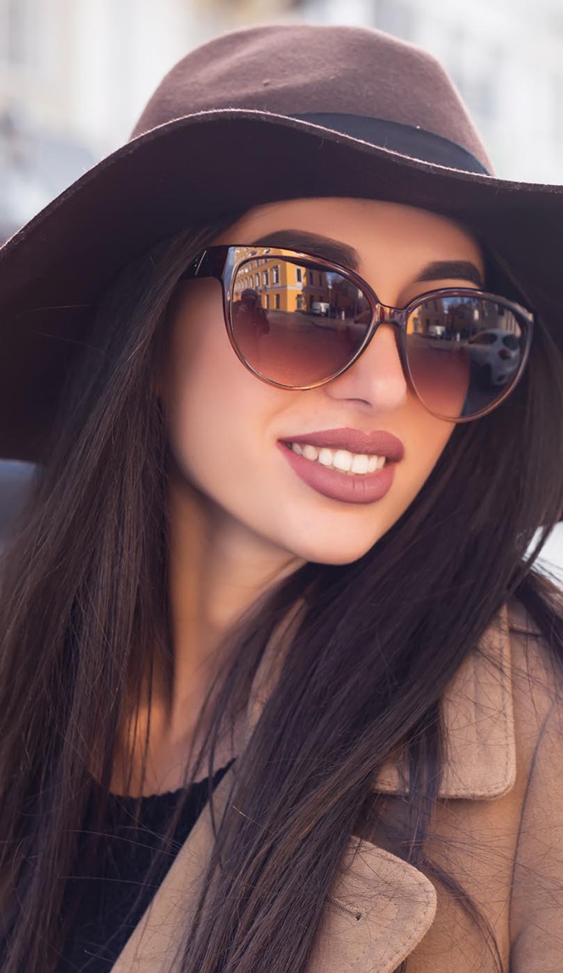 The image shows a modern dental or medical office interior with a dental chair, equipment, and a clean, professional environment.